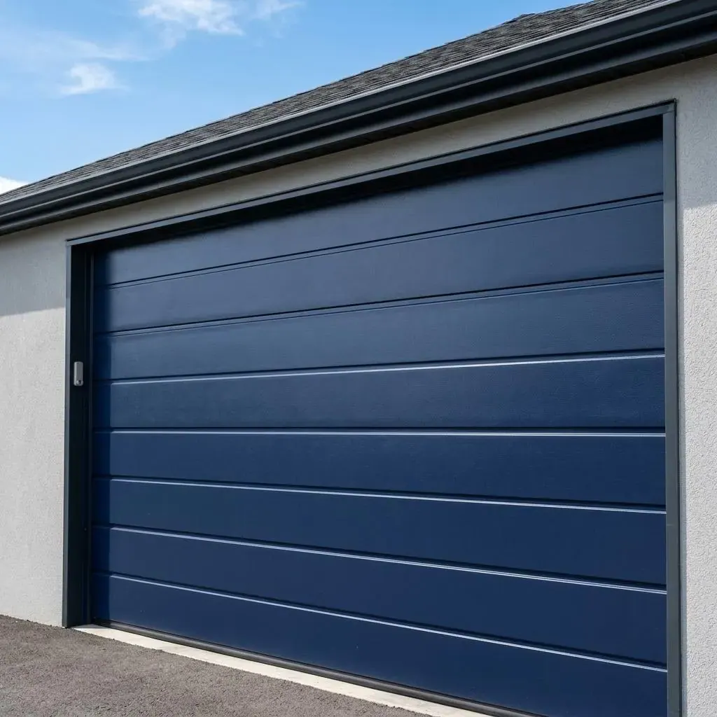 Close view of clean navy blue steel garage door panels under a blue sky